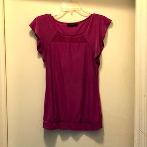 Short sleeve top. Comes down to your waist